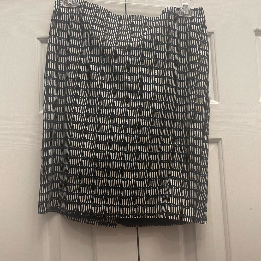 Above the knee skirt with split in the back.